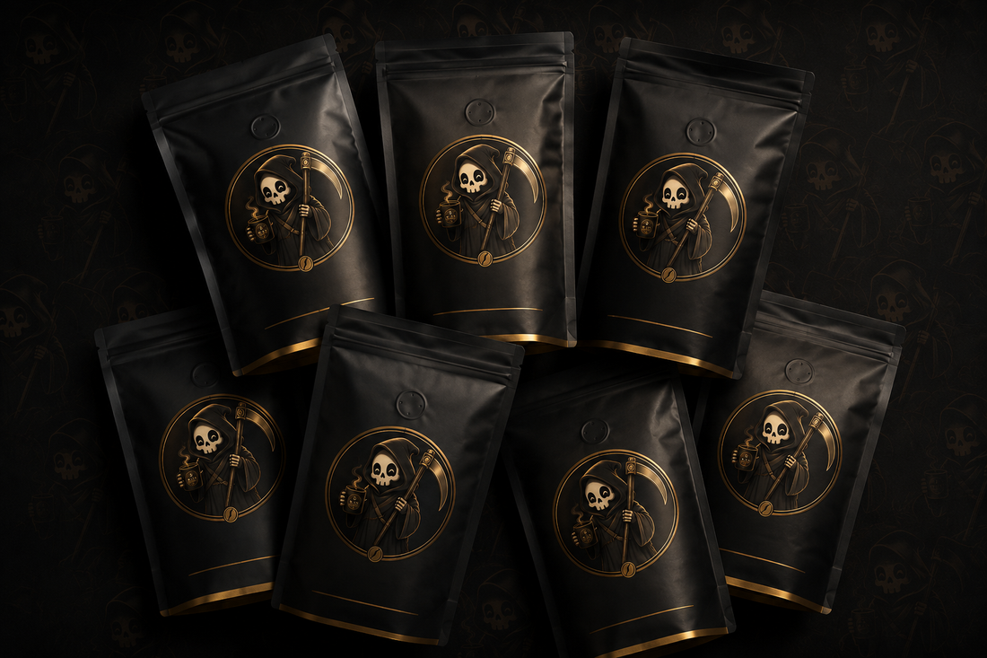 Flat-lay of Bean Reaper coffee bags with gold reaper logos on a dark background