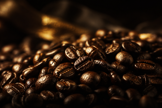 Close-up of glossy fresh-roasted coffee beans still releasing CO2 — Bean Reaper coffee bloom guide