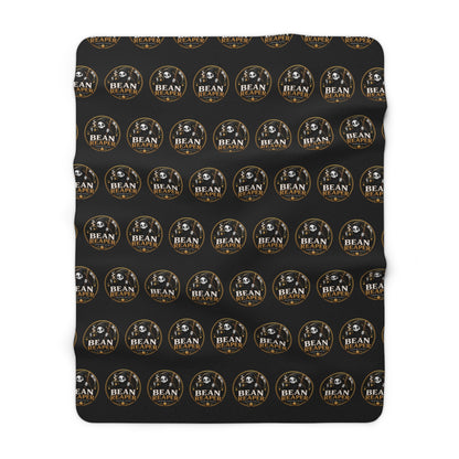 Bean Reaper sherpa blanket with skull coffee repeat pattern, cream fleece back