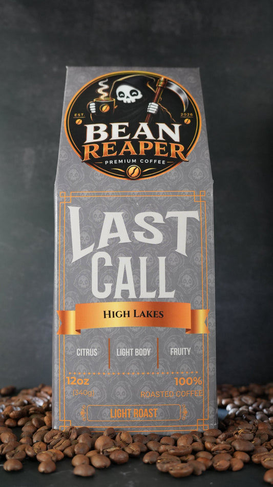 Bean Reaper Last Call coffee bag front — High Lakes, 12 oz light roast, standing on whole coffee beans