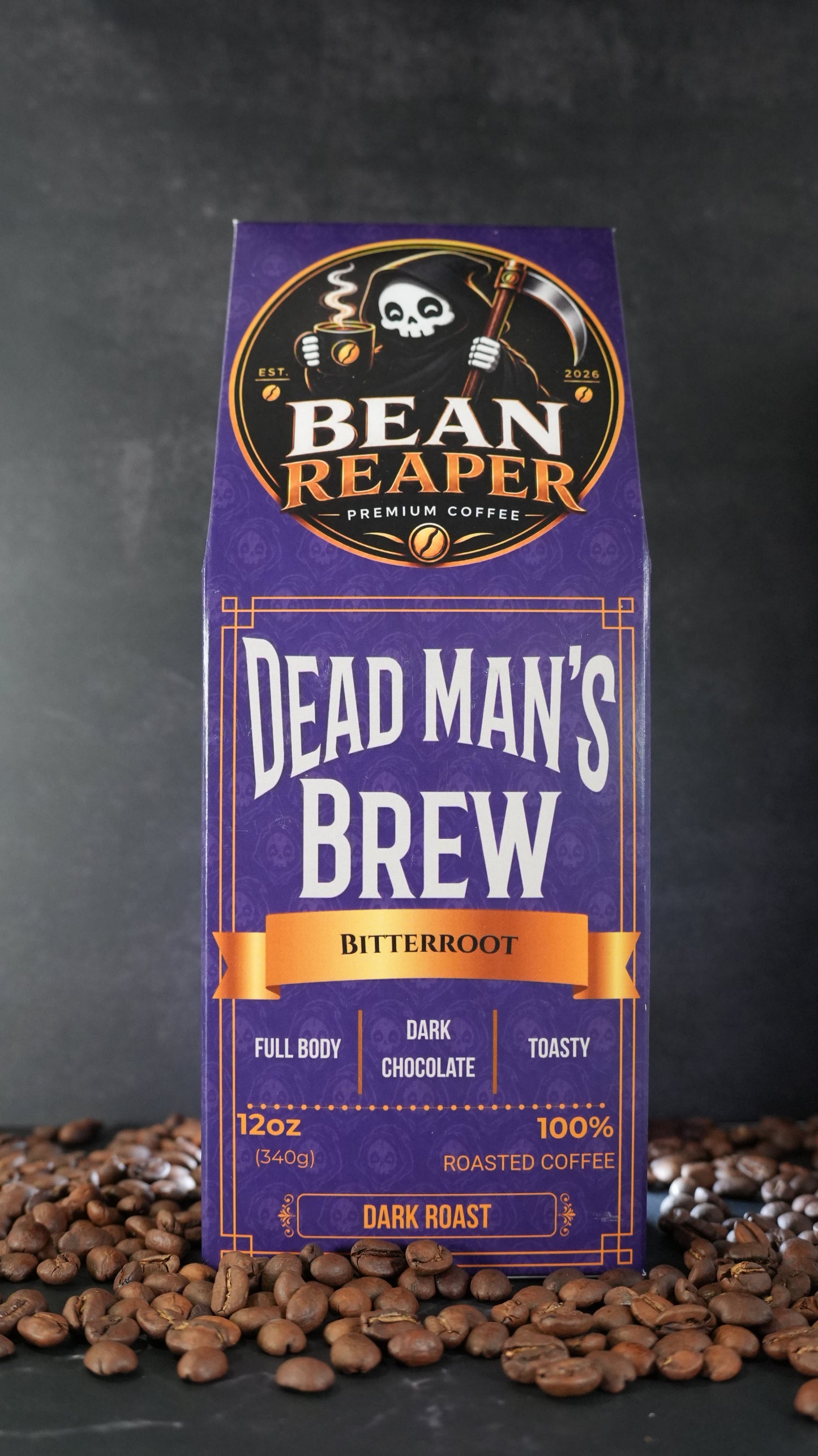 Bean Reaper Dead Man's Brew coffee bag front — Bitterroot, 12 oz dark roast, standing on whole coffee beans