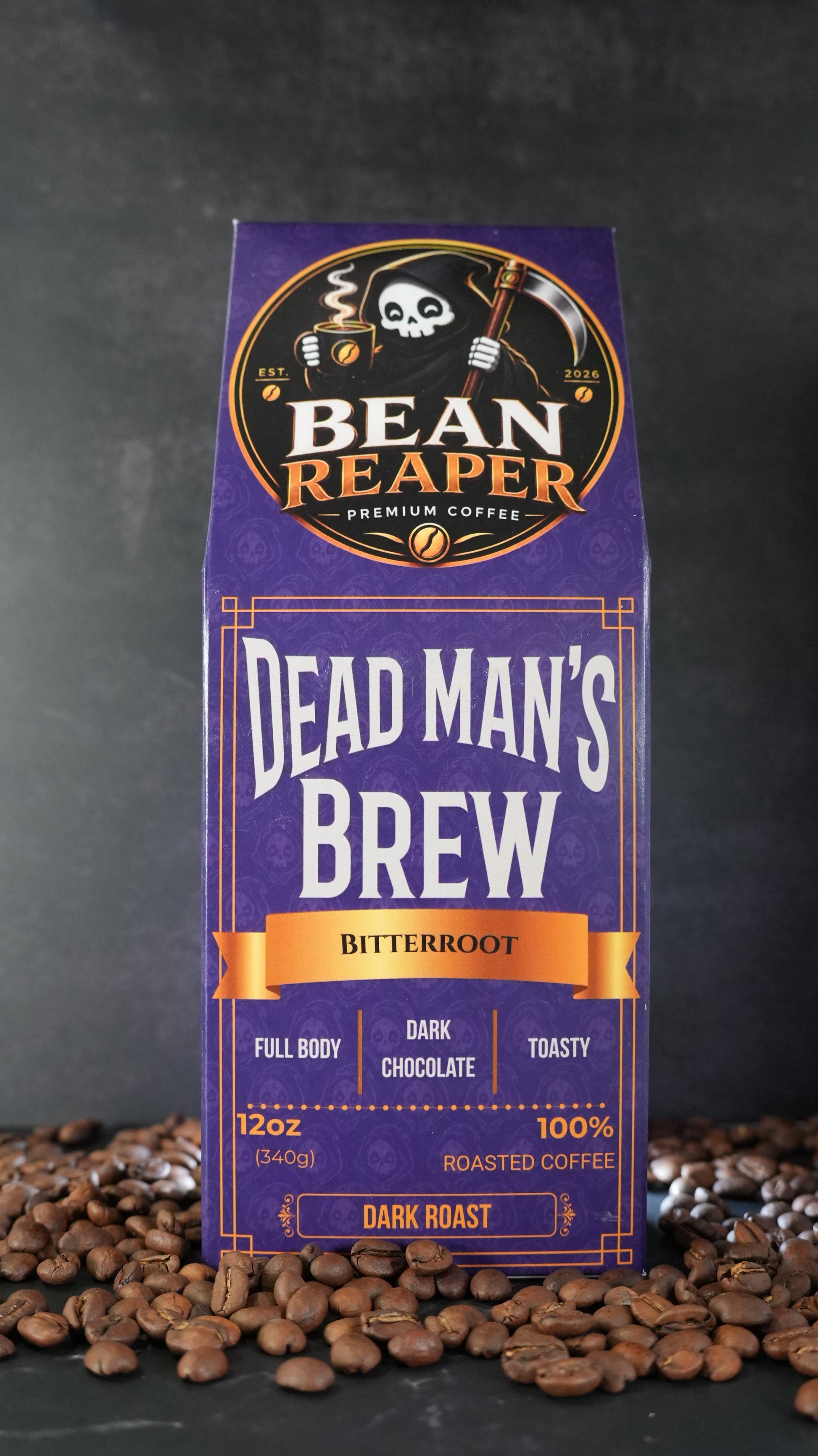 Bean Reaper Dead Man's Brew coffee bag front — Bitterroot, 12 oz dark roast, standing on whole coffee beans