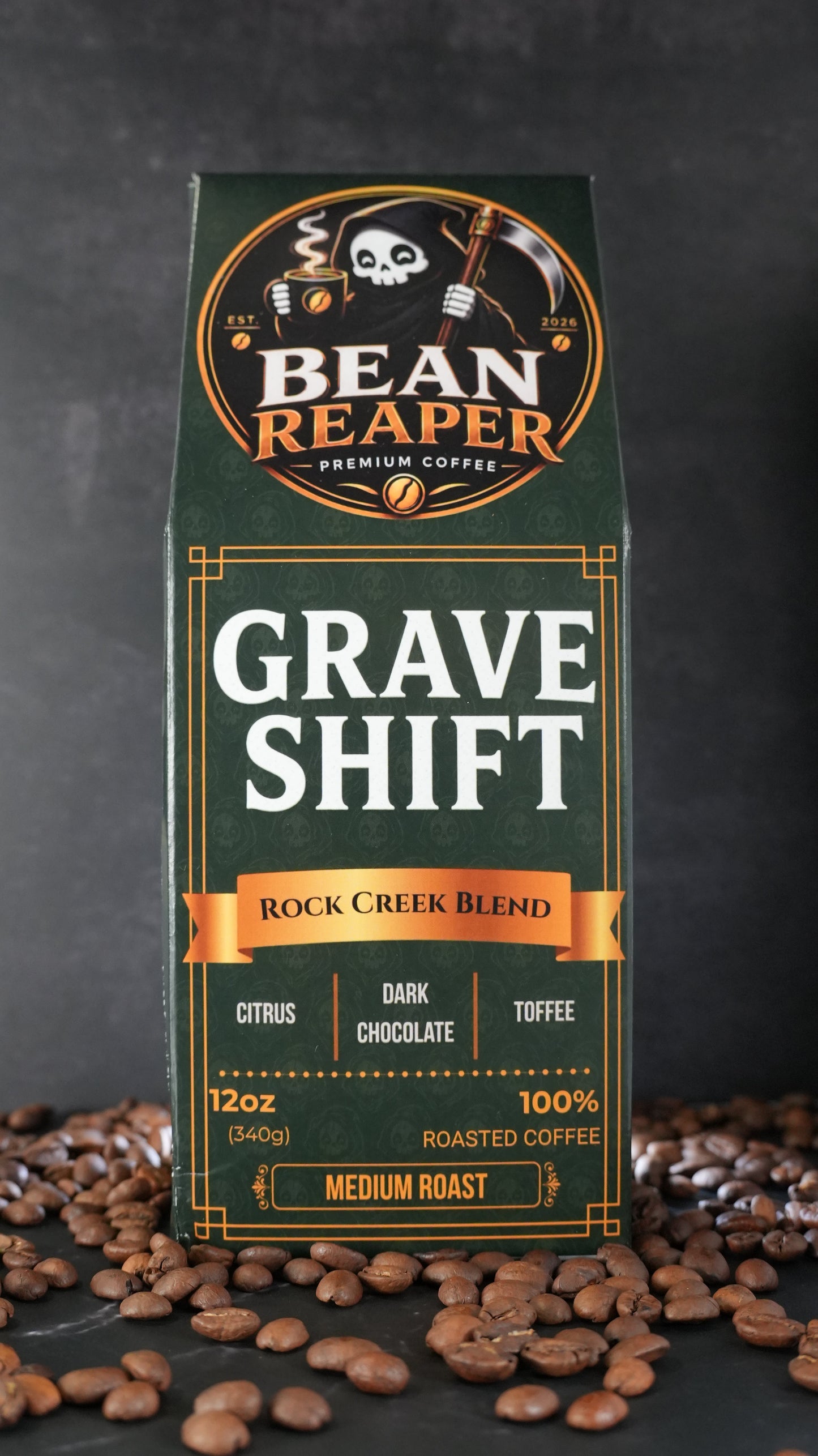 Bean Reaper Grave Shift coffee bag front — Rock Creek Blend, 12 oz medium roast, standing on whole coffee beans
