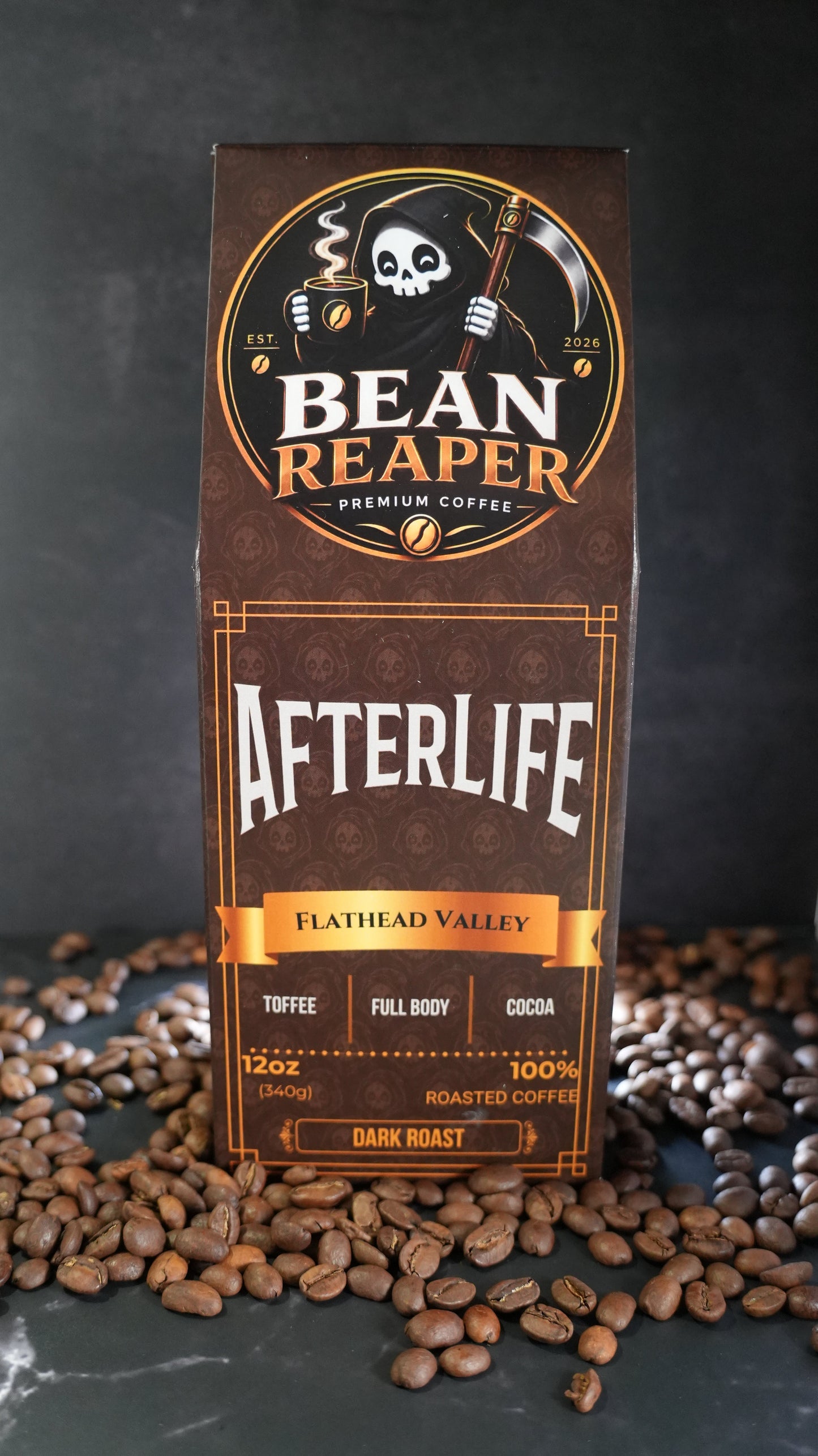 Bean Reaper Afterlife dark roast coffee bag front — Flathead Valley blend, 12 oz, standing on whole coffee beans