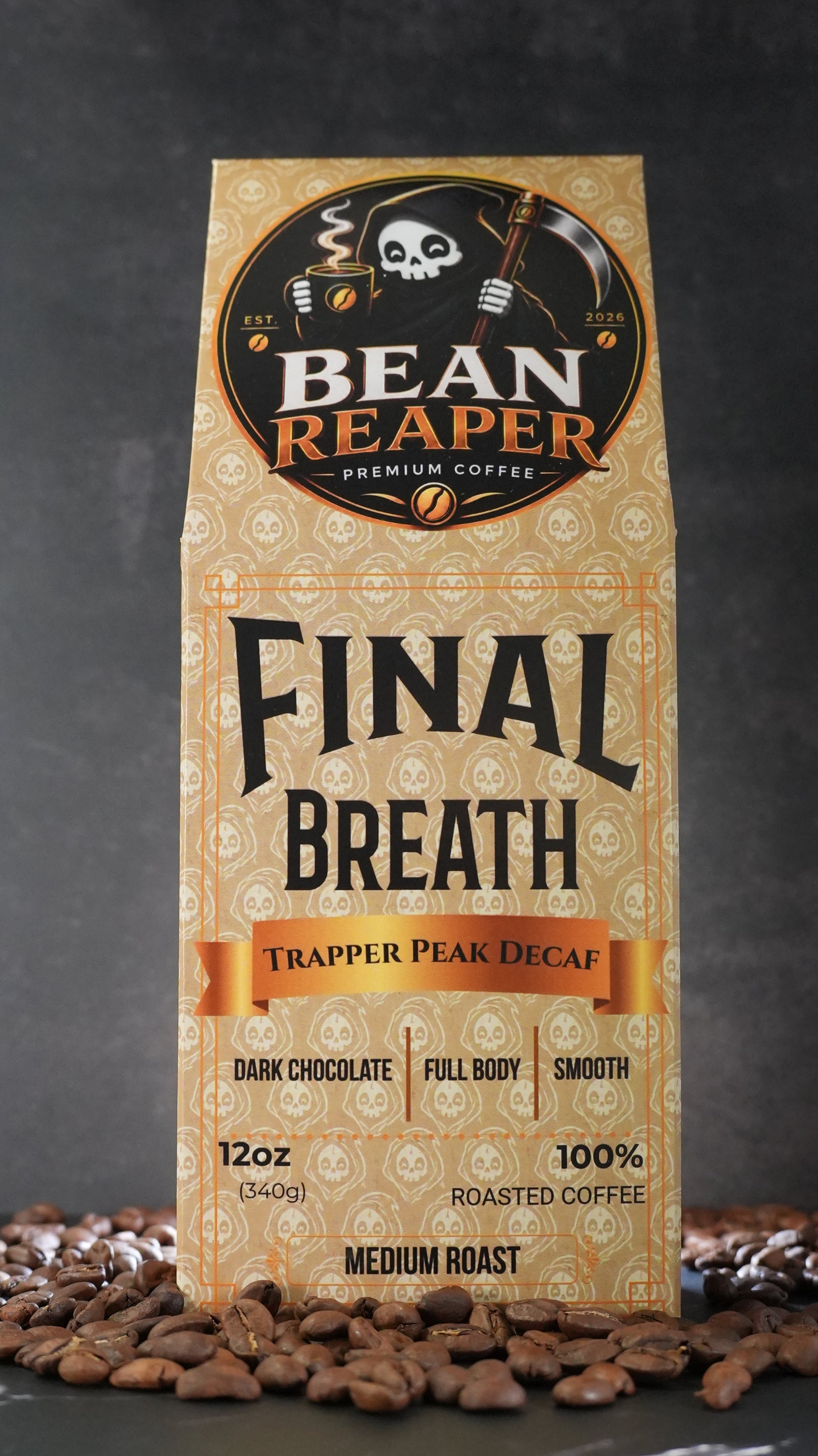 Bean Reaper Final Breath decaf coffee bag front — Trapper Peak Decaf, 12 oz medium roast, standing on whole coffee beans
